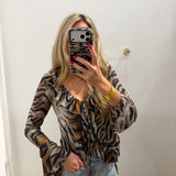 TIGER STRIPE RUFFLE TIE BLOUSE