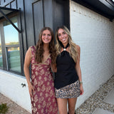 BLACK ASYMMETRICAL GOLD HARDWARE HALTER TOP