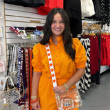 ORANGE RUFFLE BUTTON DOWN ROMPER